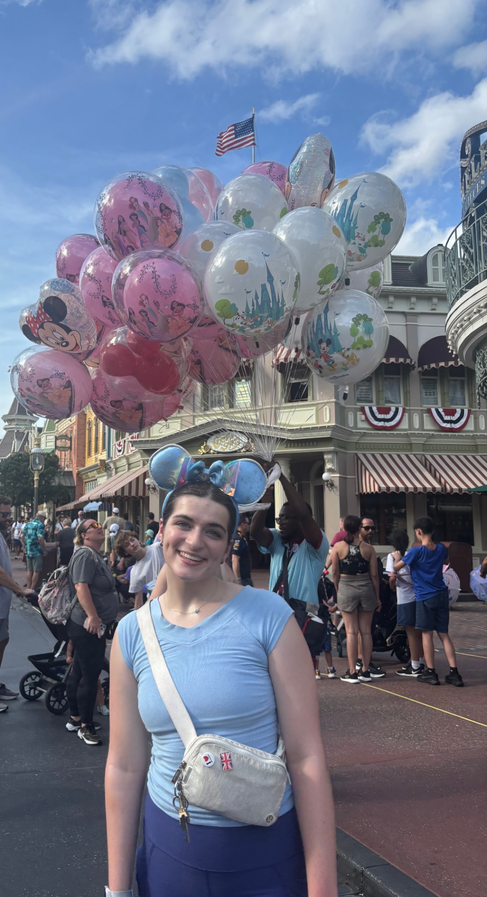 Hardin teen with Disney character balloons on Main Street USA