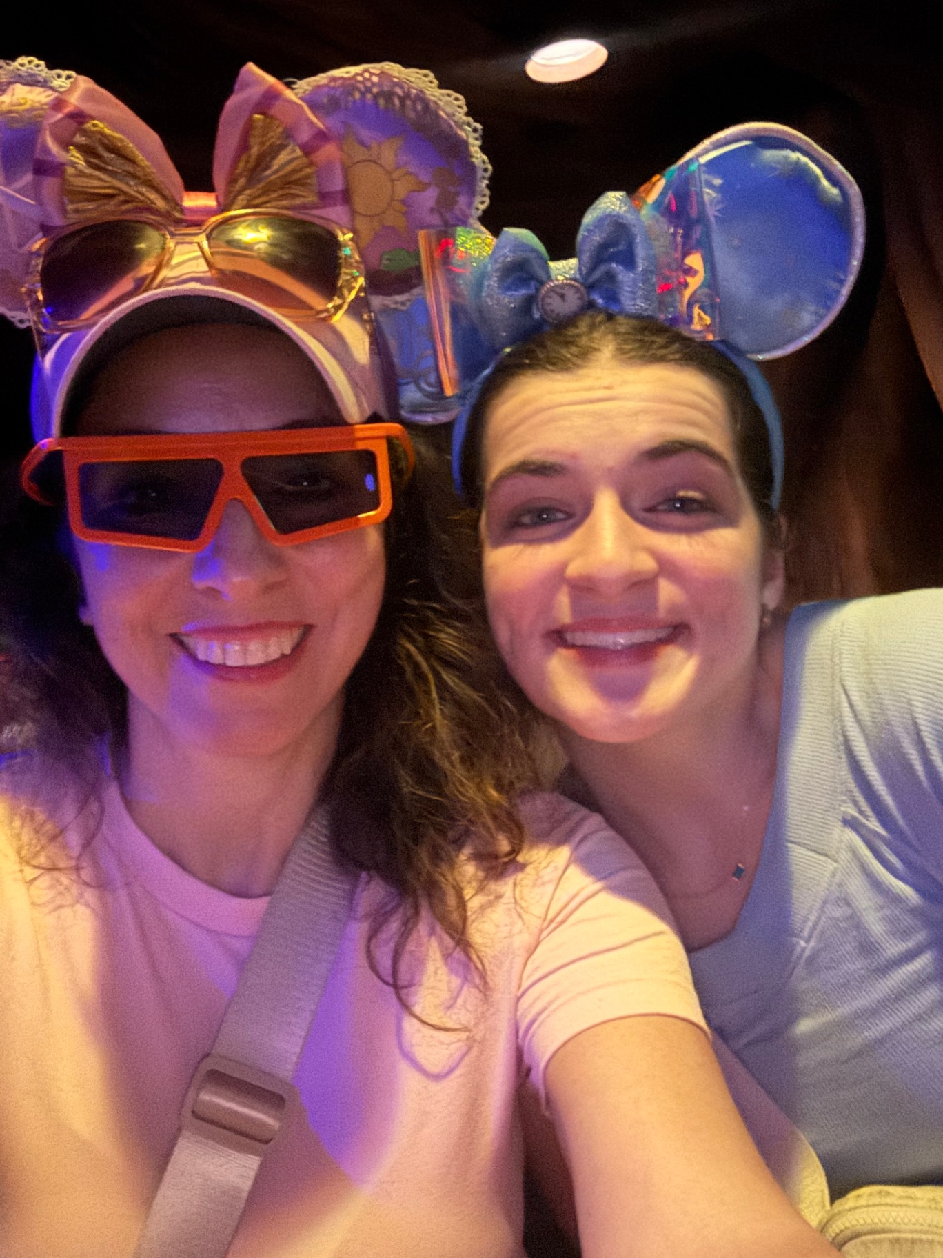 Mom and daughter in matching Disney ears with 3D ride glasses